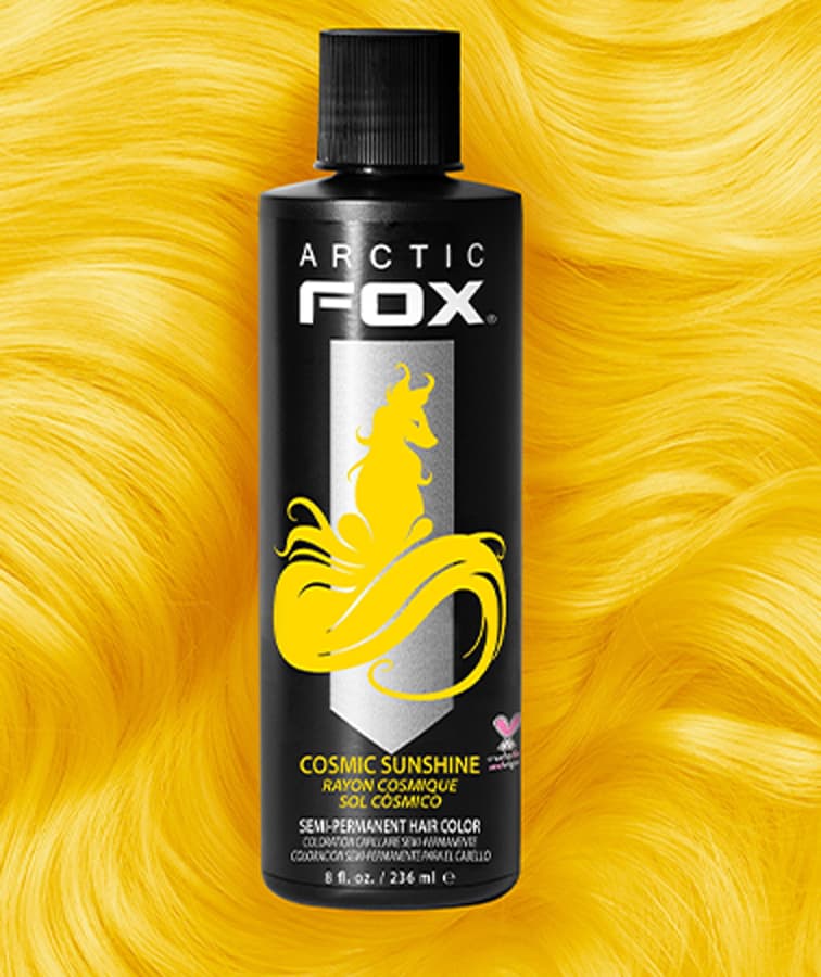 Arctic Fox Cosmic Sunshine hair dye set against a brilliant yellow hair swatch, evoking the brightness of pure sunlight.