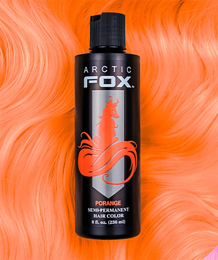 Arctic Fox Porange hair color bottle against a backdrop of radiant orange-red hair, capturing the essence of a vivid, sunlit coral hue.